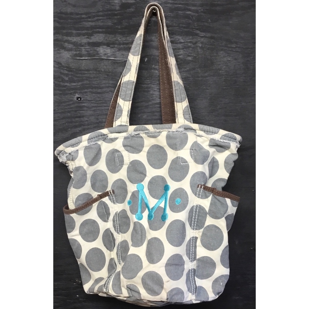 thirty-one tote with an M monogram embroidered on it